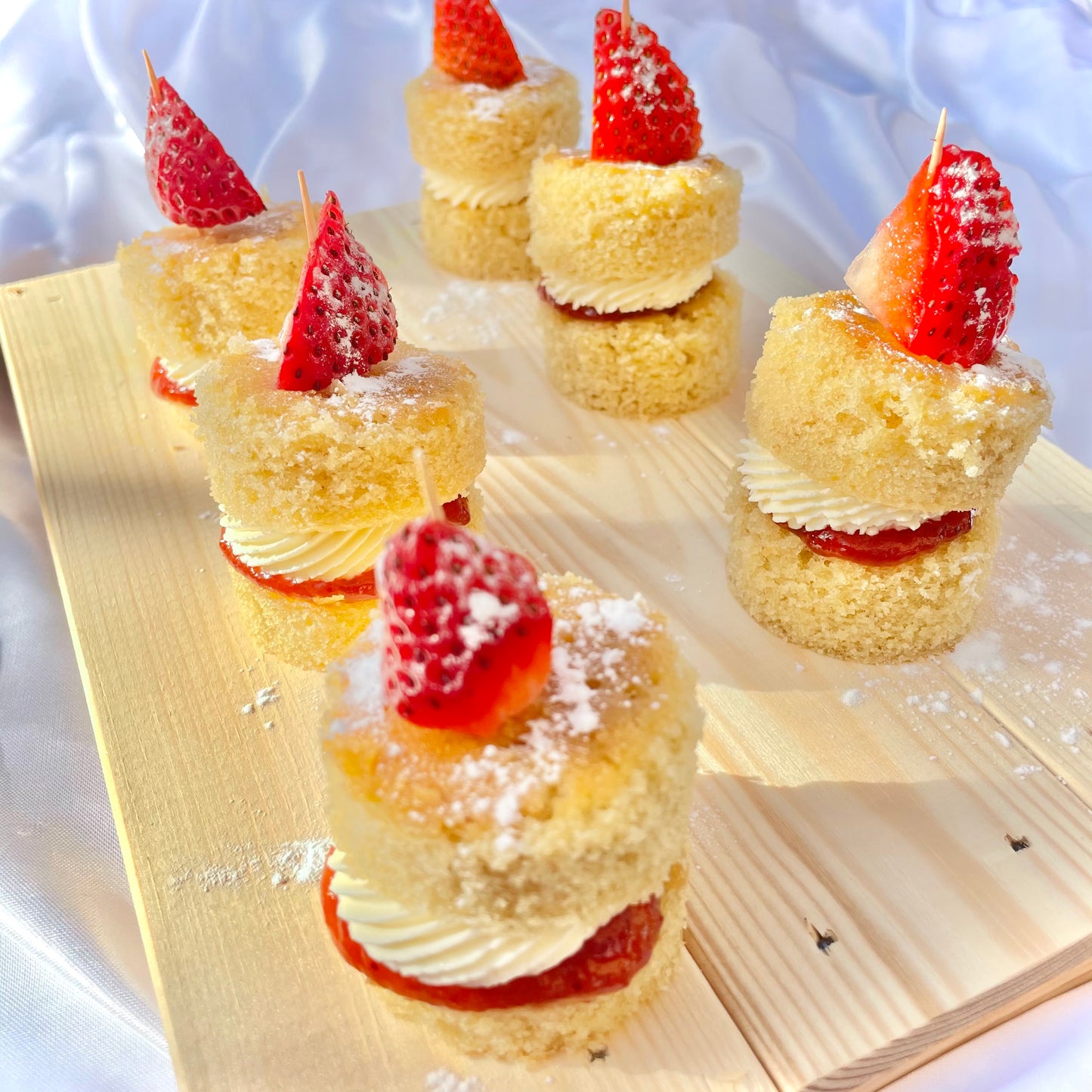 Mini Victoria sponge cakes with strawberry top